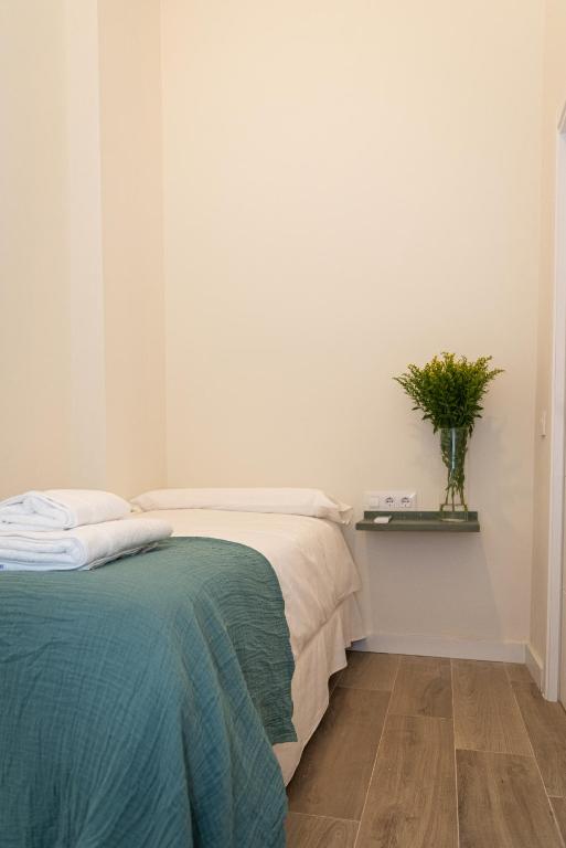 Posteľ alebo postele v izbe v ubytovaní La Casa del Pintor Apartments