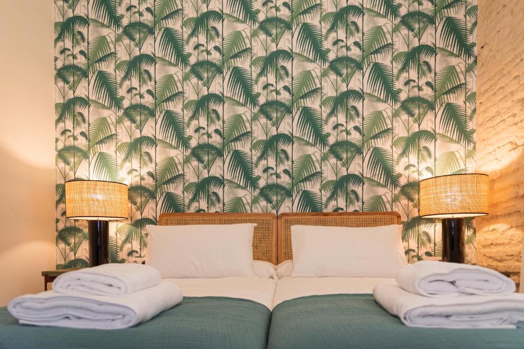 Posteľ alebo postele v izbe v ubytovaní La Casa del Pintor Apartments