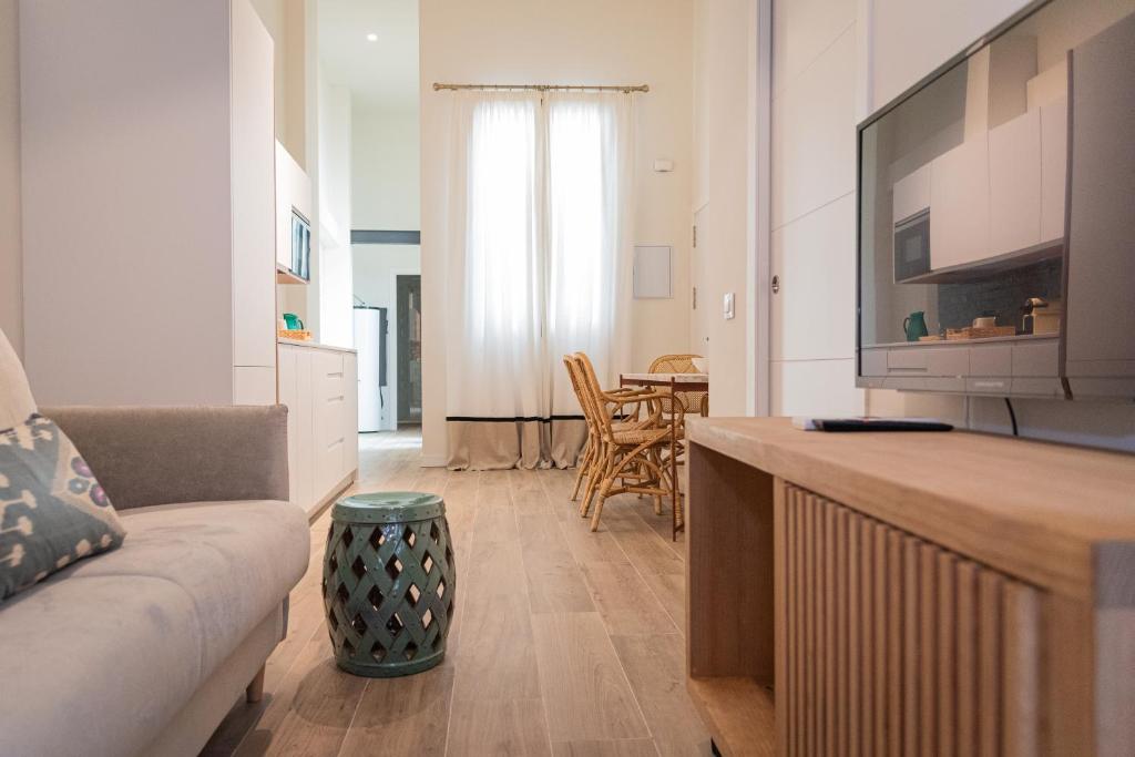 Televízia a/alebo spoločenská miestnosť v ubytovaní La Casa del Pintor Apartments