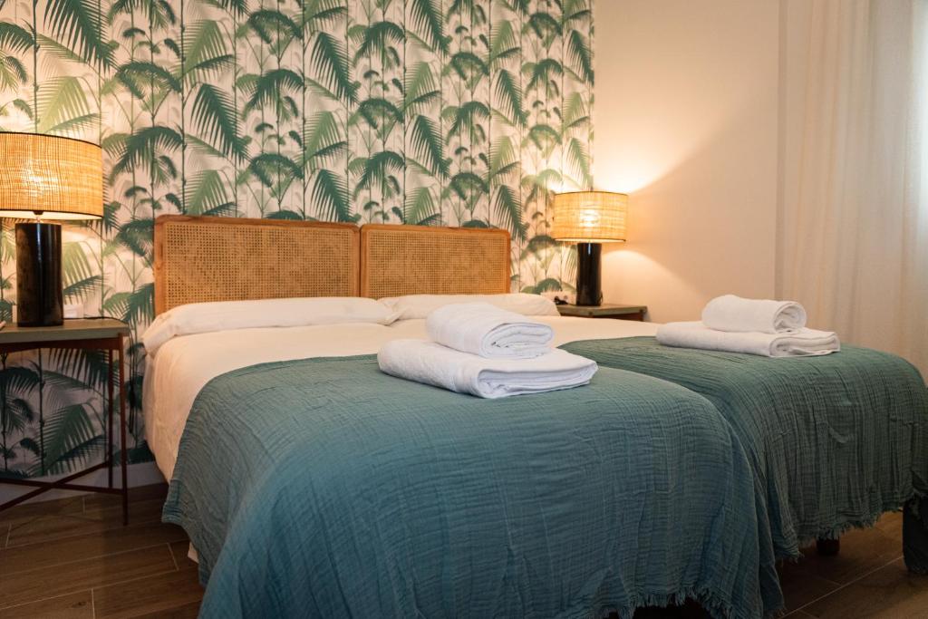 Posteľ alebo postele v izbe v ubytovaní La Casa del Pintor Apartments