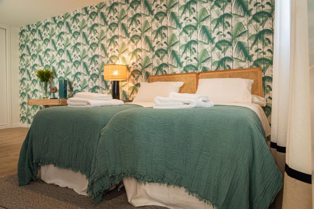 Posteľ alebo postele v izbe v ubytovaní La Casa del Pintor Apartments