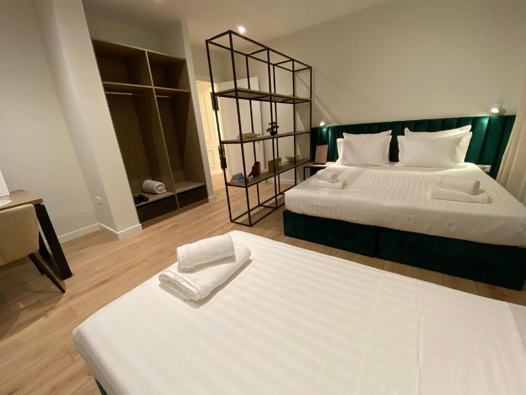 Postel nebo postele na pokoji v ubytování Living Studio Apartments