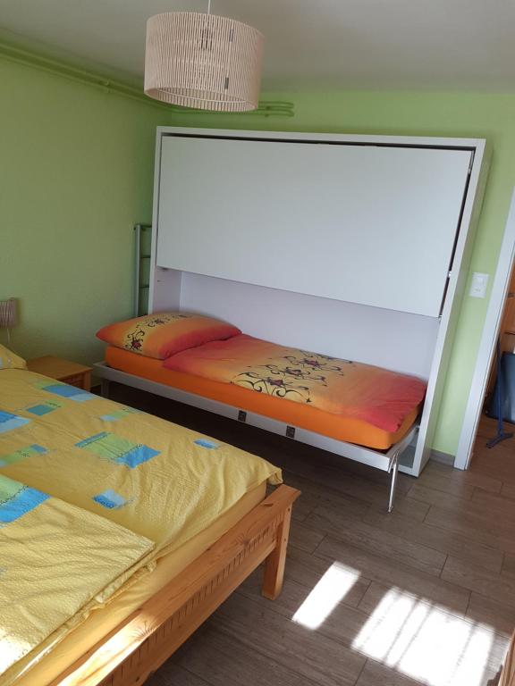 Postel nebo postele na pokoji v ubytování appartement "bellevue"