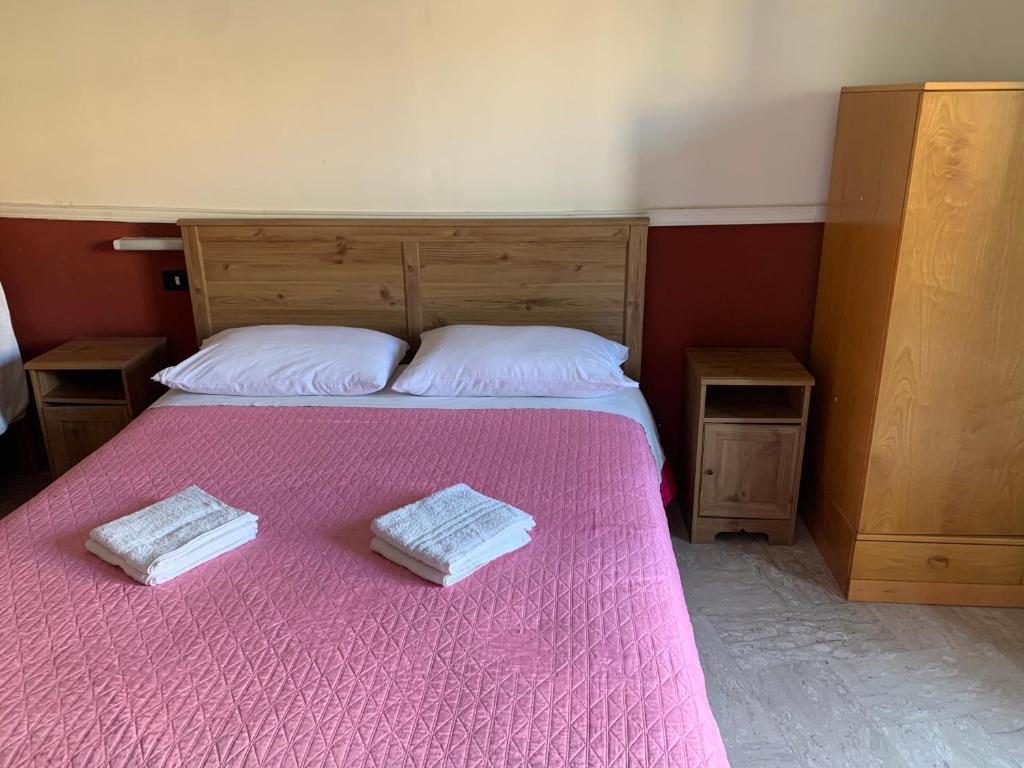 Postel nebo postele na pokoji v ubytování Hotel Apollo