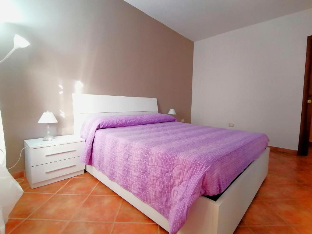 Postel nebo postele na pokoji v ubytování calloni franceschini home