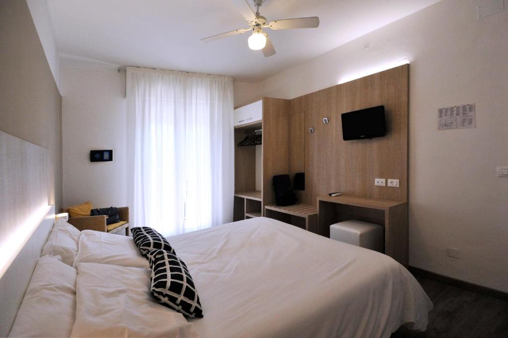 Postel nebo postele na pokoji v ubytování Hotel Etna