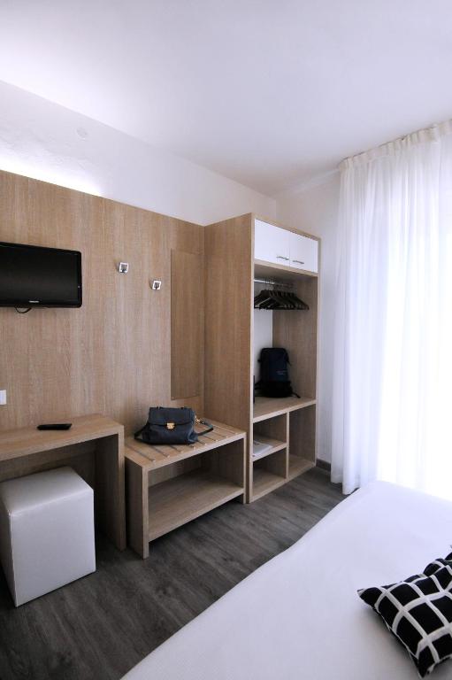 Postel nebo postele na pokoji v ubytování Hotel Etna