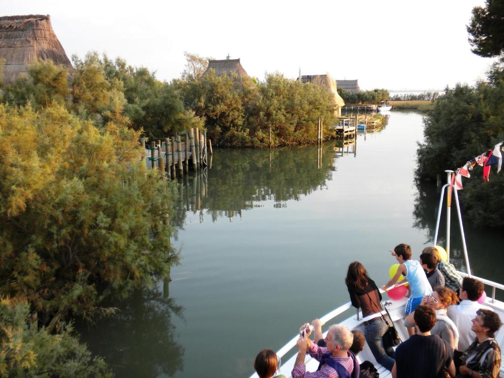 a group of people on a boat on a river at Zero5.Zero5 in Lignano Sabbiadoro