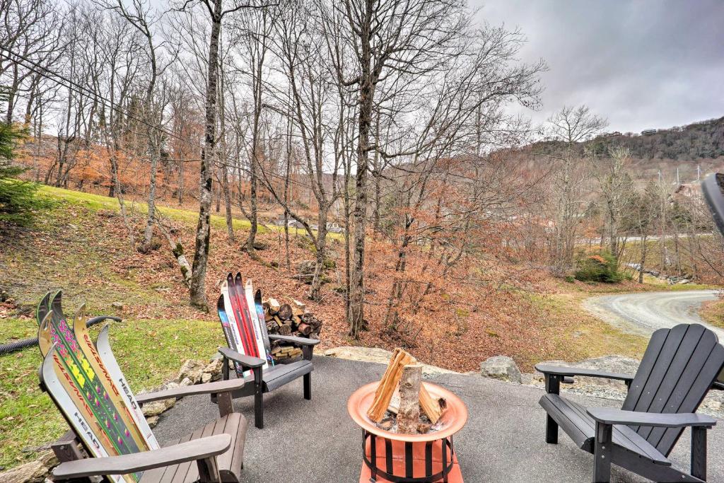 a group of chairs and a fire pit on a patio at Cozy Mtn Getaway - Steps to Beech Mountain Resort! in Beech Mountain