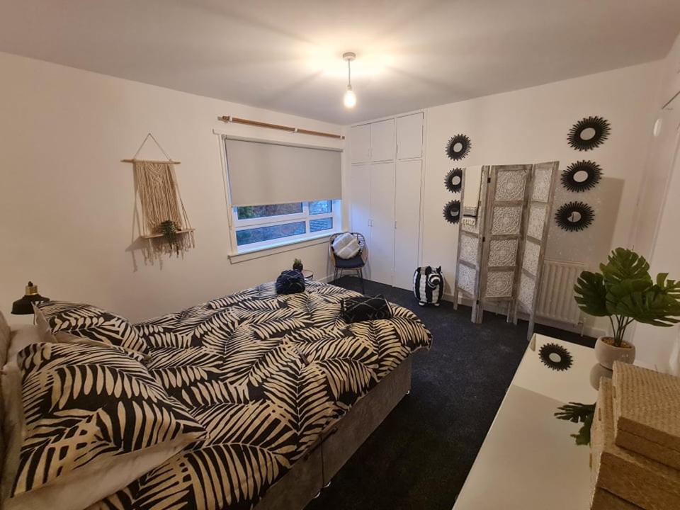 Un pat sau paturi într-o cameră la Harden Place