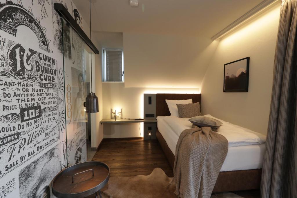 Postel nebo postele na pokoji v ubytování REINHARDTs HOTEL