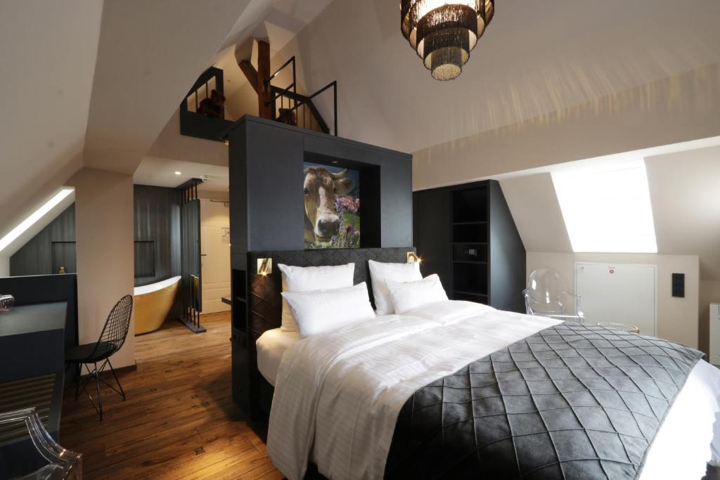Postel nebo postele na pokoji v ubytování REINHARDTs HOTEL