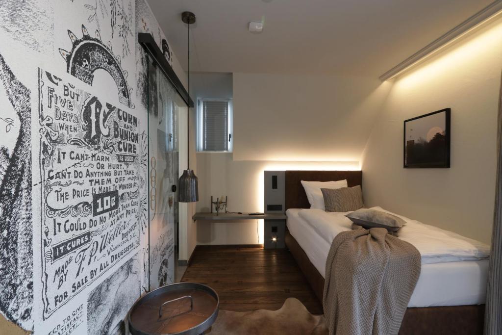 Postel nebo postele na pokoji v ubytování REINHARDTs HOTEL