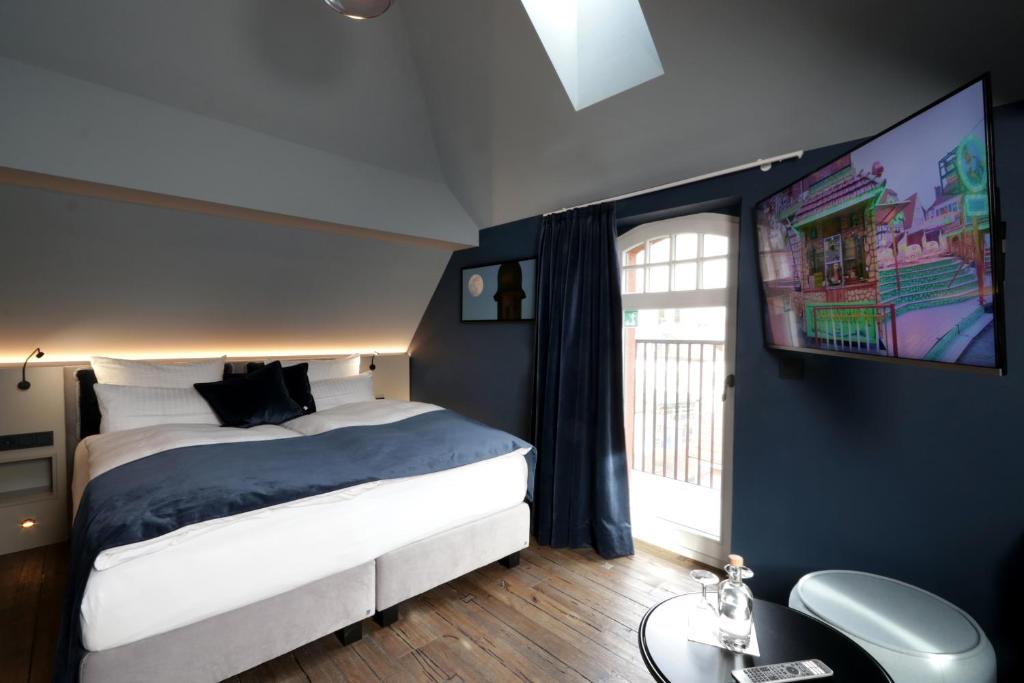 Postel nebo postele na pokoji v ubytování REINHARDTs HOTEL