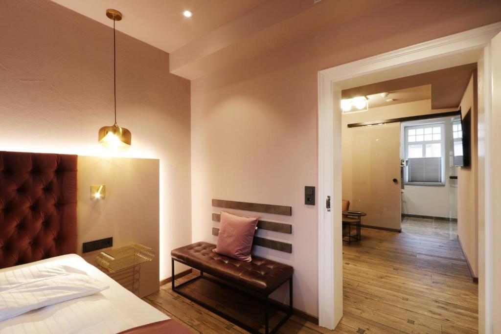 Postel nebo postele na pokoji v ubytování REINHARDTs HOTEL