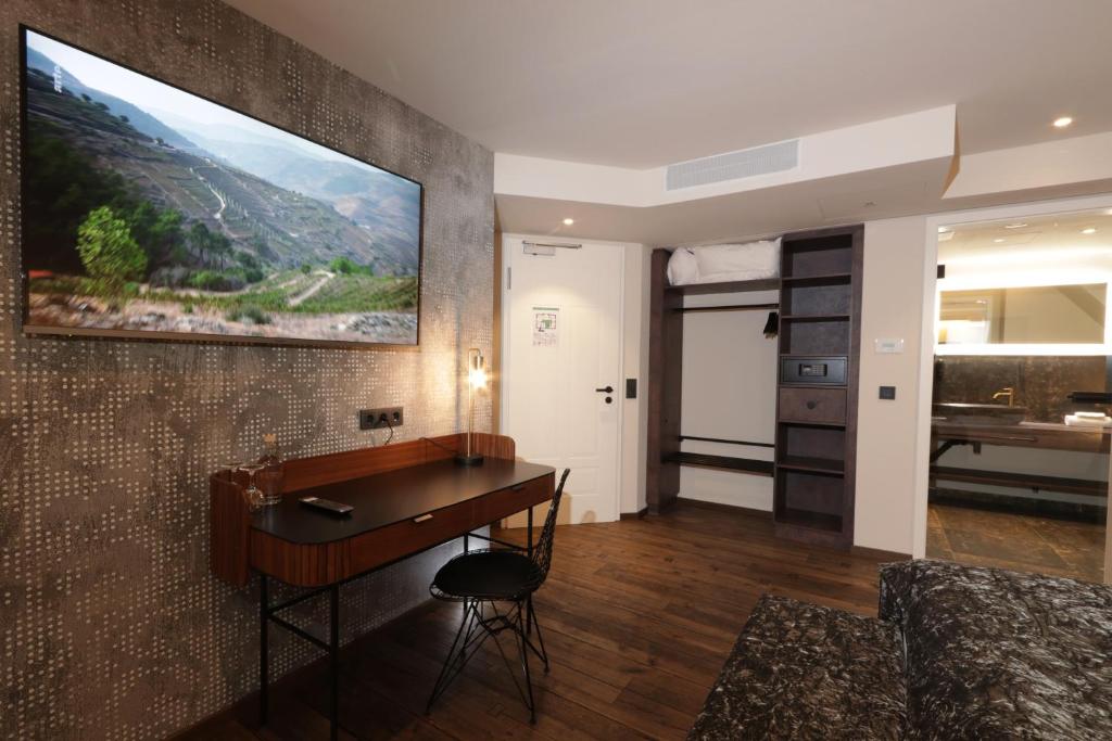 TV a/nebo společenská místnost v ubytování REINHARDTs HOTEL