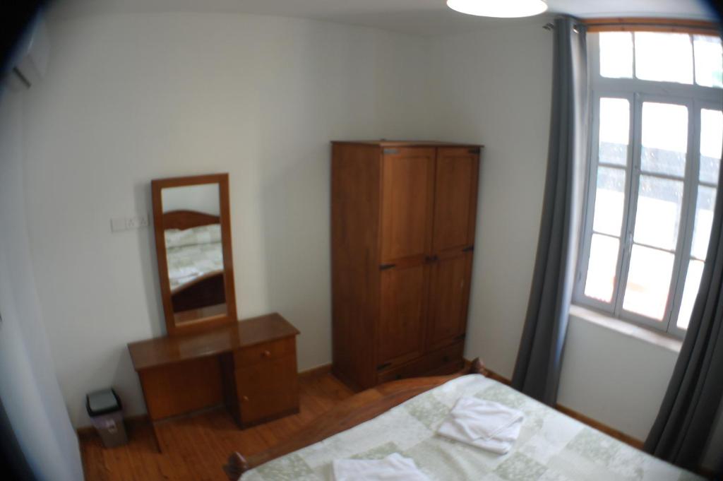 Postel nebo postele na pokoji v ubytování Harrys Inn Guesthouse
