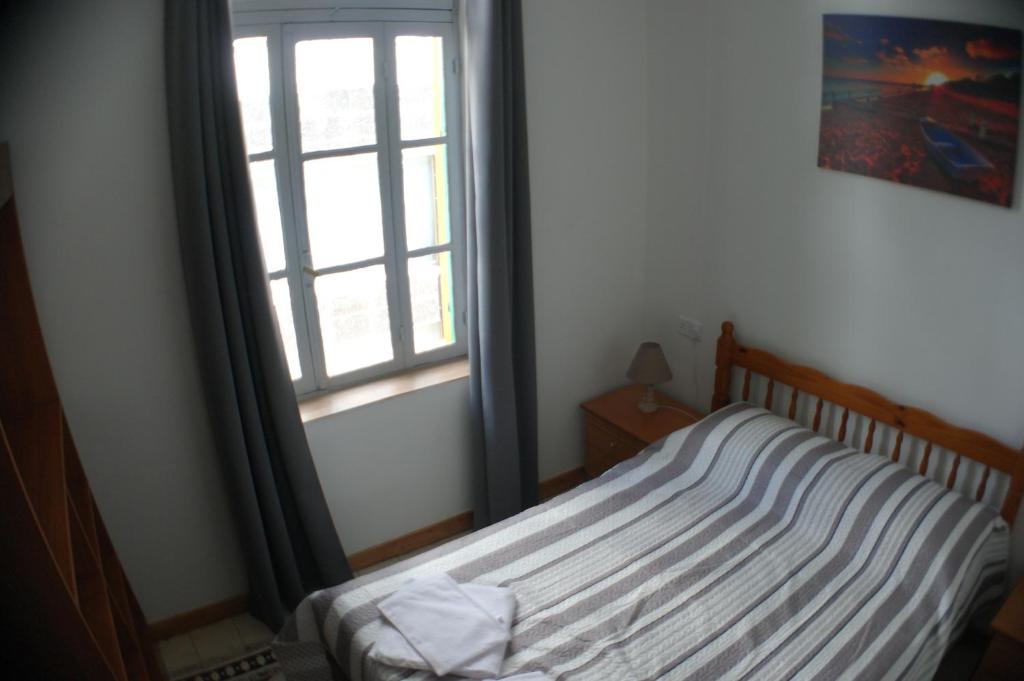 Postel nebo postele na pokoji v ubytování Harrys Inn Guesthouse