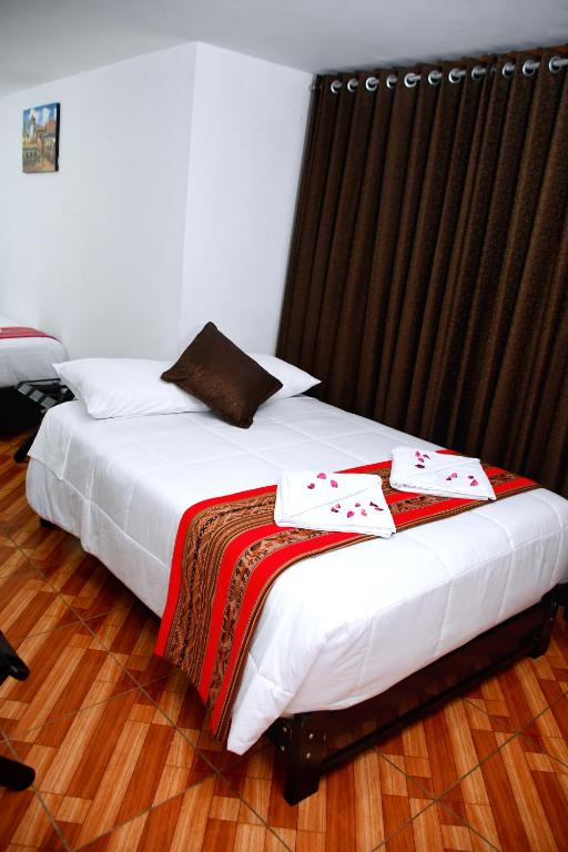 Postel nebo postele na pokoji v ubytování Peru Coca B&B Machupicchu