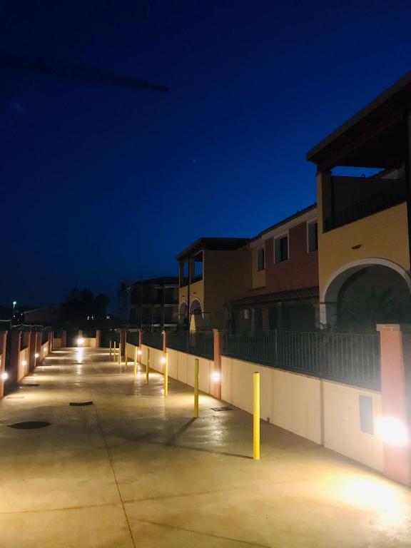 a row of lights in a parking lot at night at HomeStyle Agorà in Villasimius
