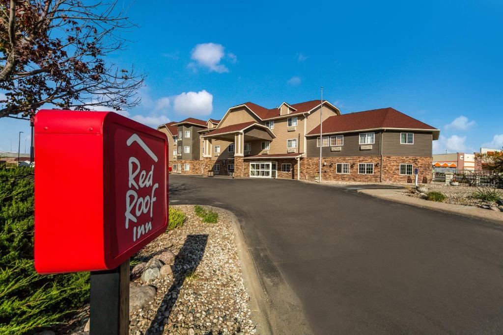 a red mailbox in front of a house at Red Roof Inn & Suites Omaha - Council Bluffs in Council Bluffs
