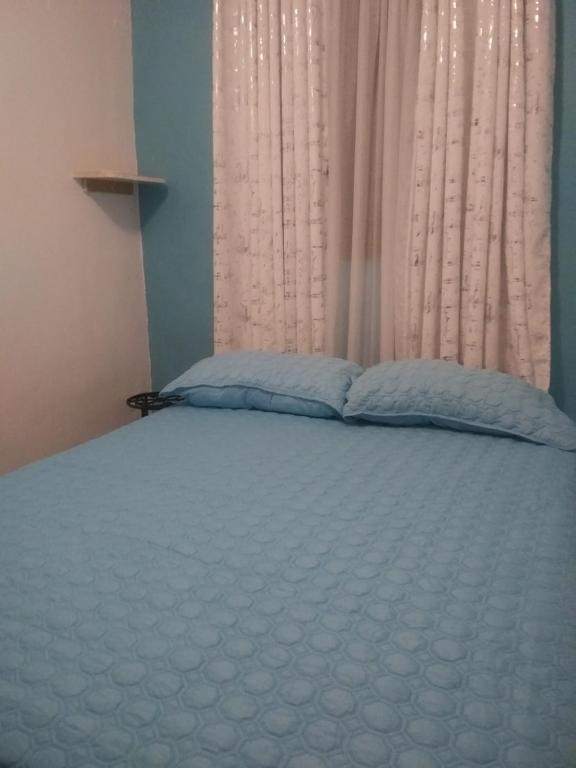 Postel nebo postele na pokoji v ubytování Brisas de Borinquen