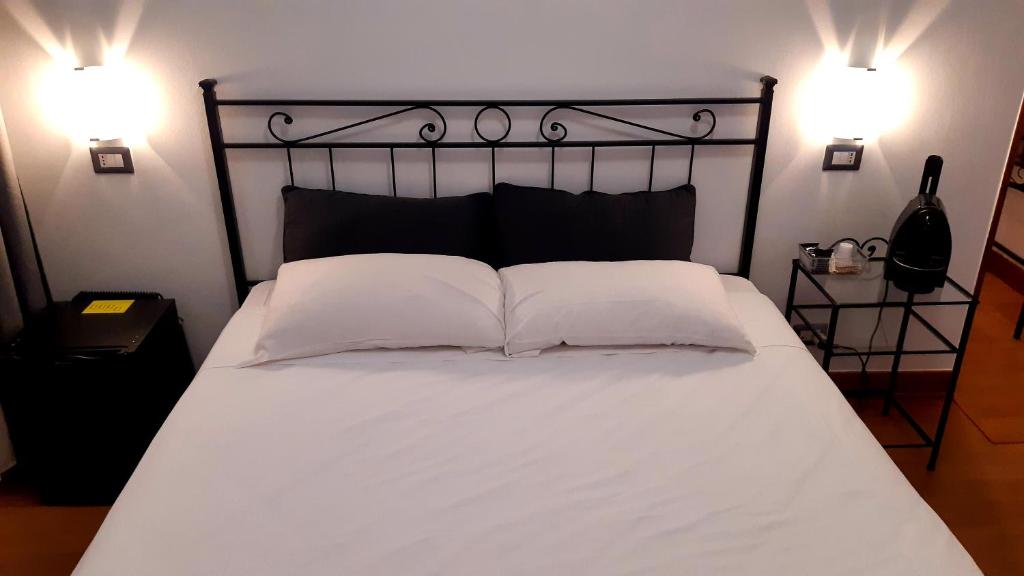 Letto o letti in una camera di Guest House Masterintrastevere