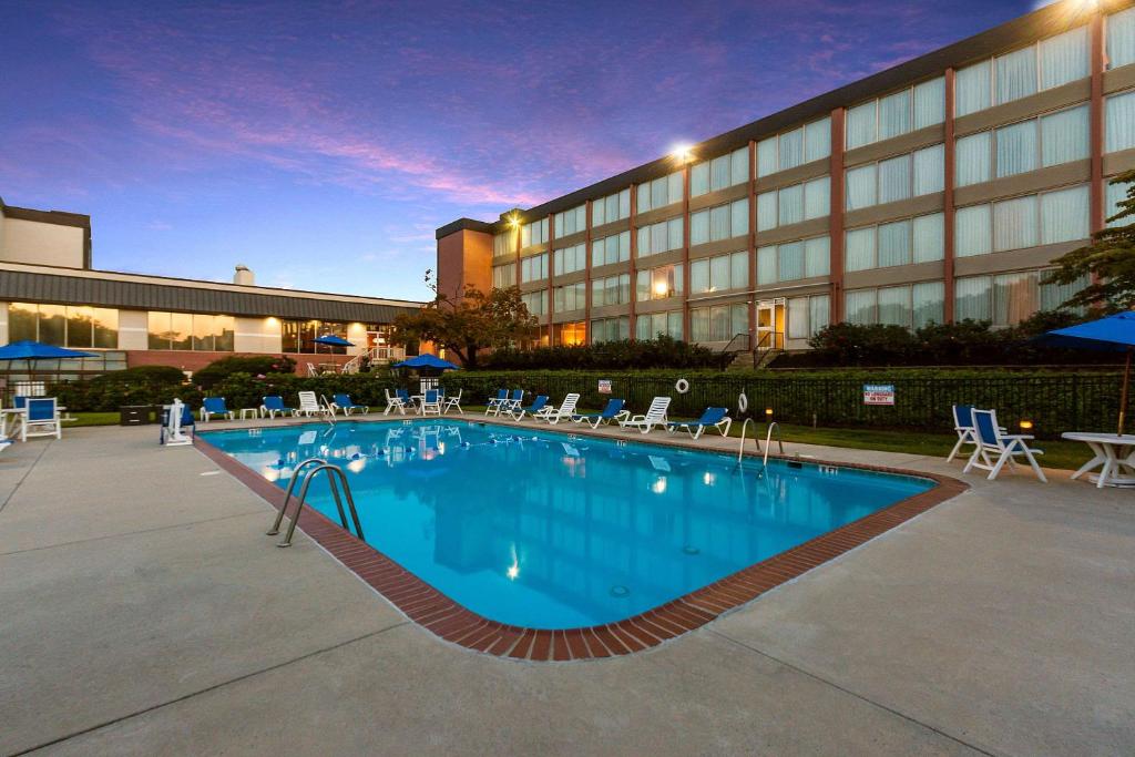 a large swimming pool in front of a hotel at Exton Hotel and Conference Center in Exton