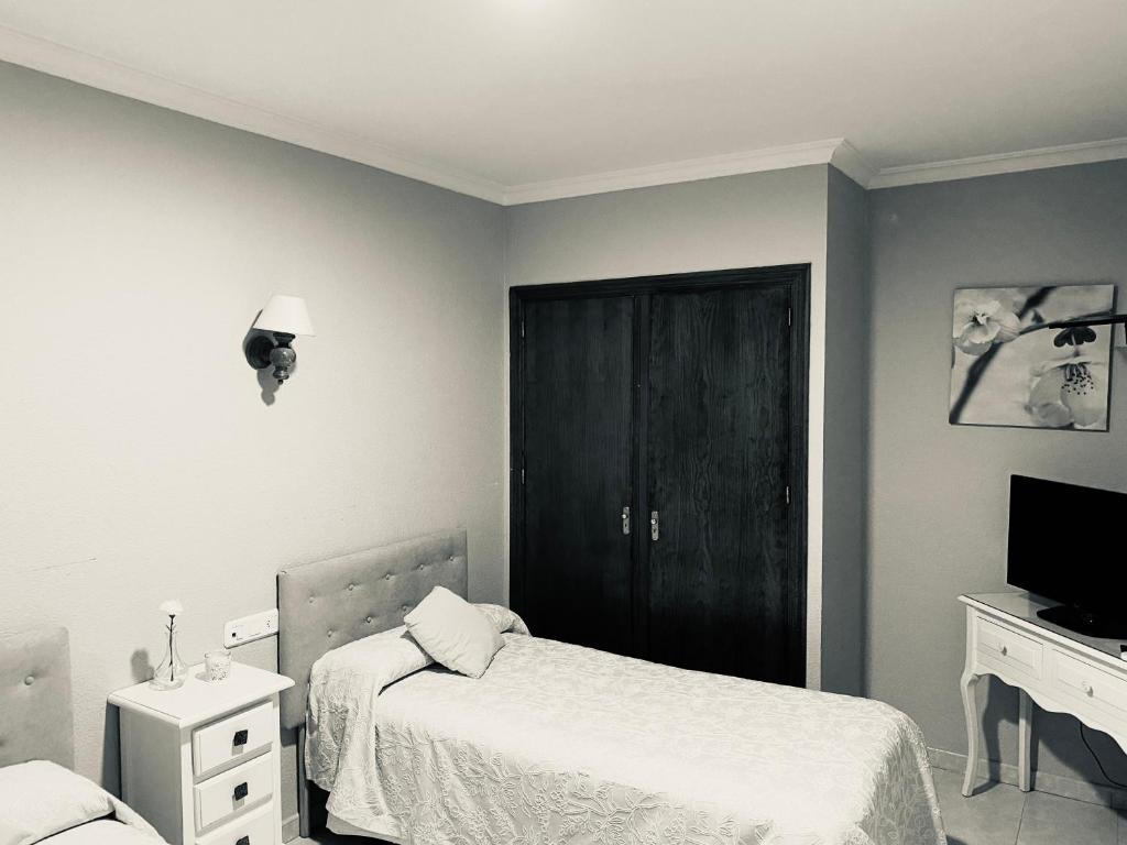 Postel nebo postele na pokoji v ubytování Hostal Restaurante Puerto Blanco