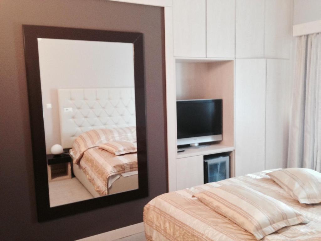Posteľ alebo postele v izbe v ubytovaní Hotel Consul