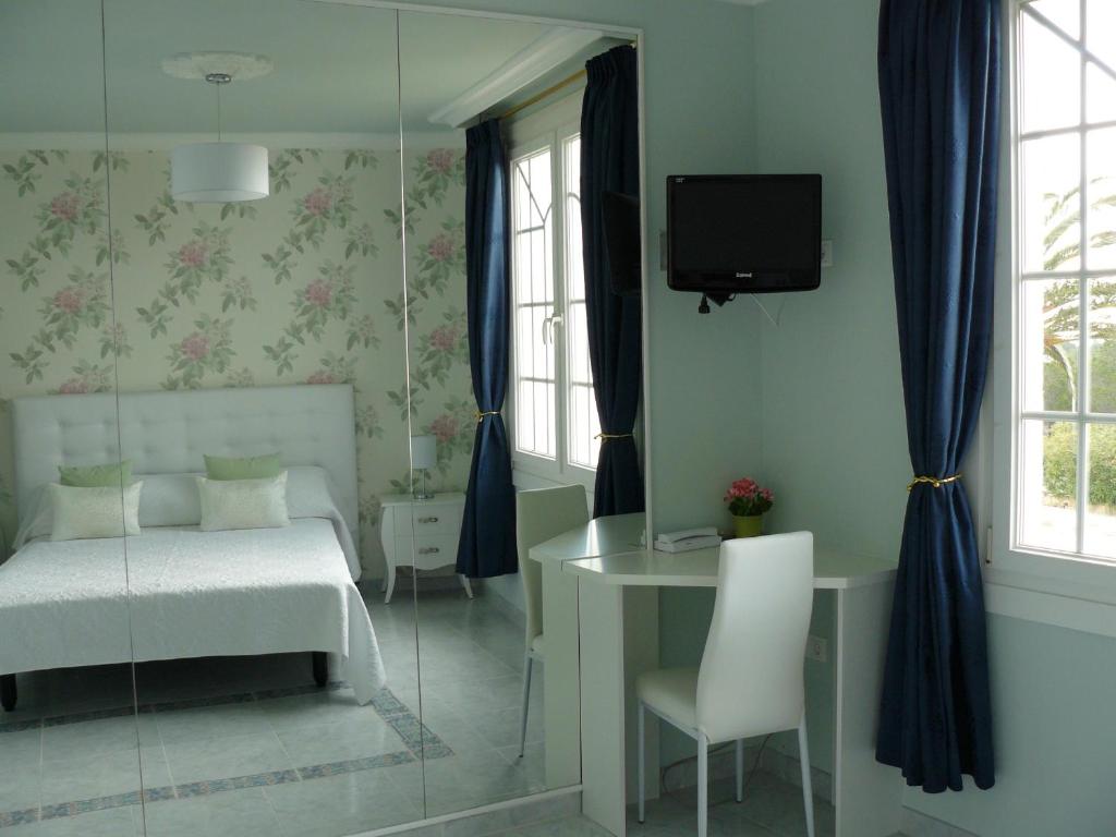 Postel nebo postele na pokoji v ubytování Hotel Villaclara