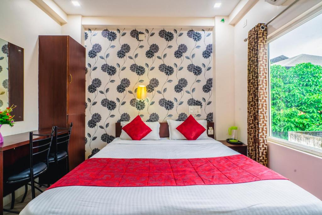 Postel nebo postele na pokoji v ubytování Almas Residency