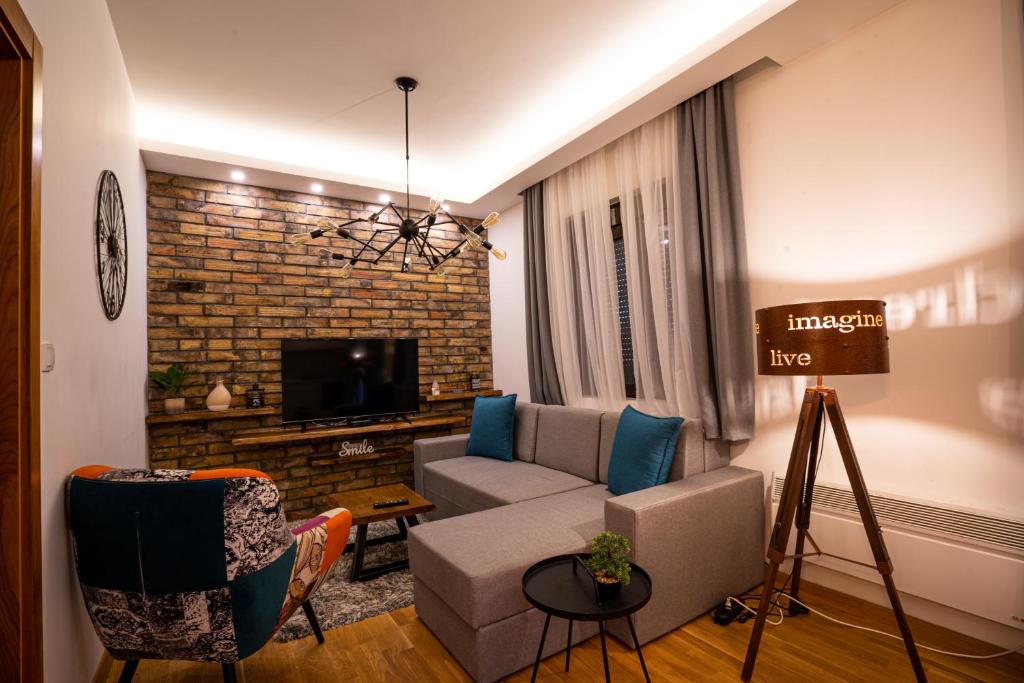 TV a/nebo společenská místnost v ubytování All Seasons Residence