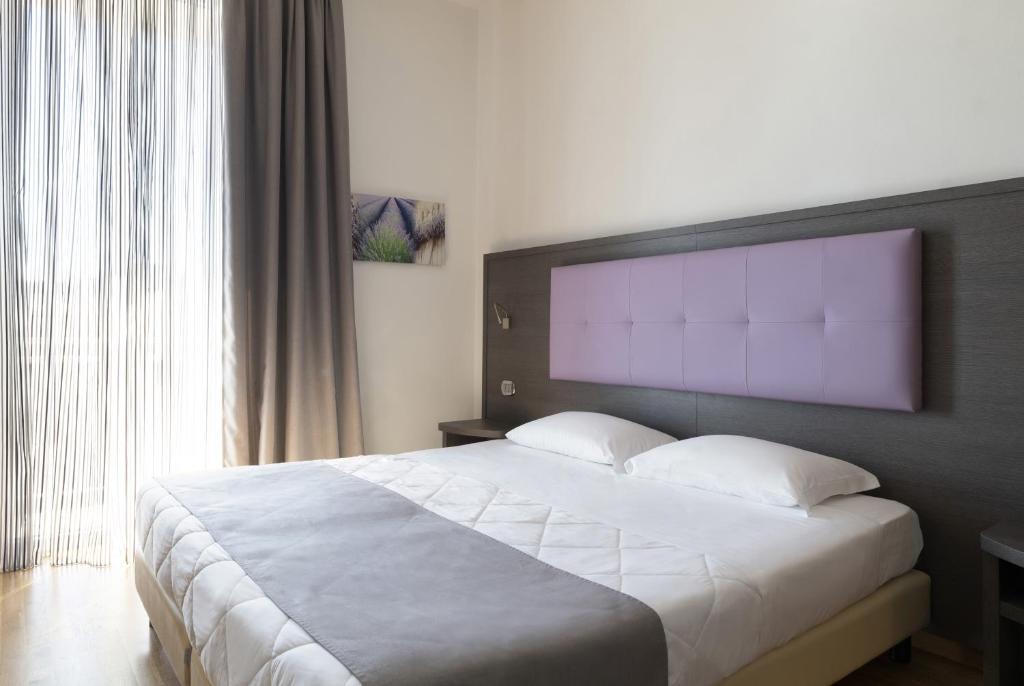 Postel nebo postele na pokoji v ubytování Hotel Settentrionale Esplanade