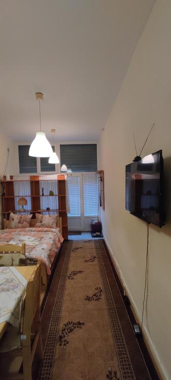 A bed or beds in a room at Comfortable and cosy studio near NDK