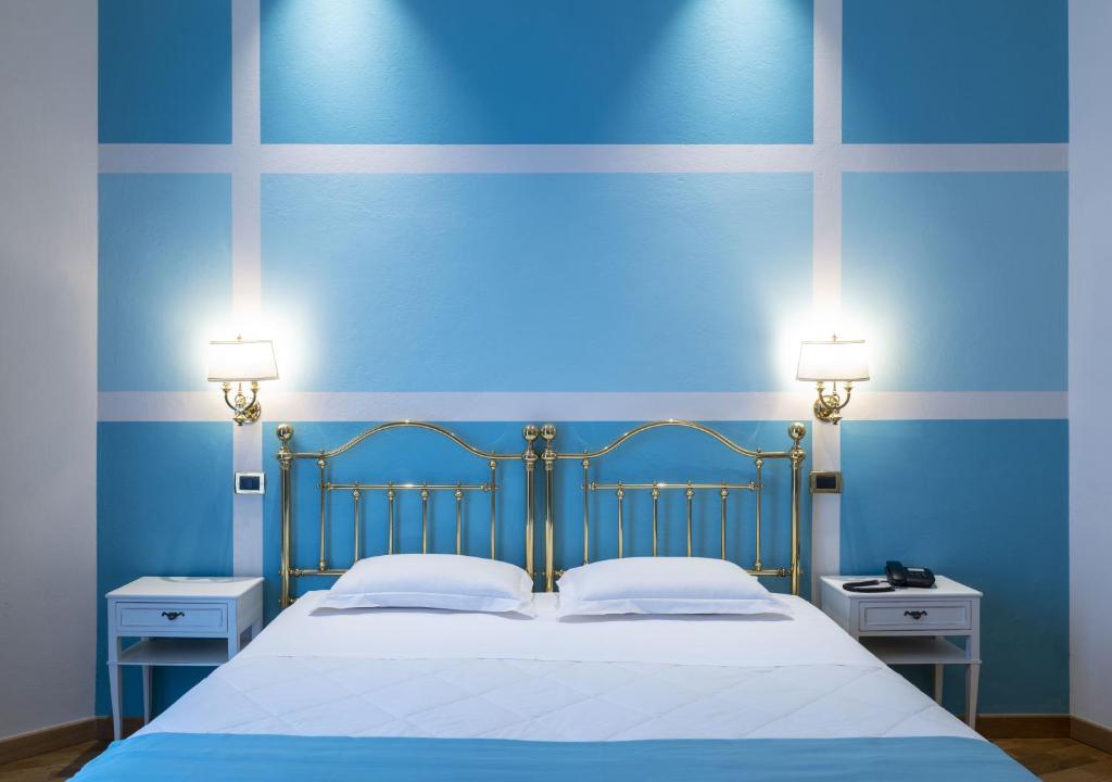 Postel nebo postele na pokoji v ubytování Hotel Settentrionale Esplanade