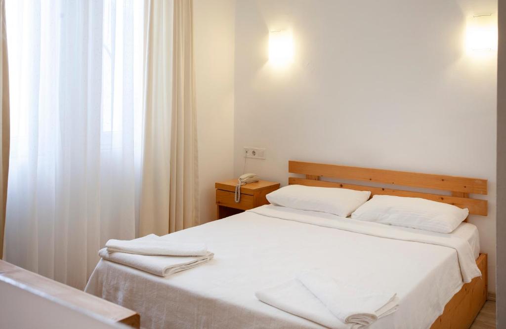 Postel nebo postele na pokoji v ubytování Zephyros City Otel