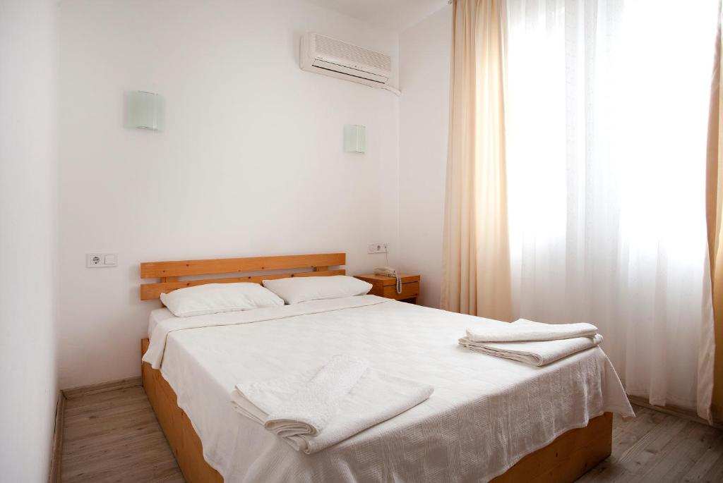 Postel nebo postele na pokoji v ubytování Zephyros City Otel