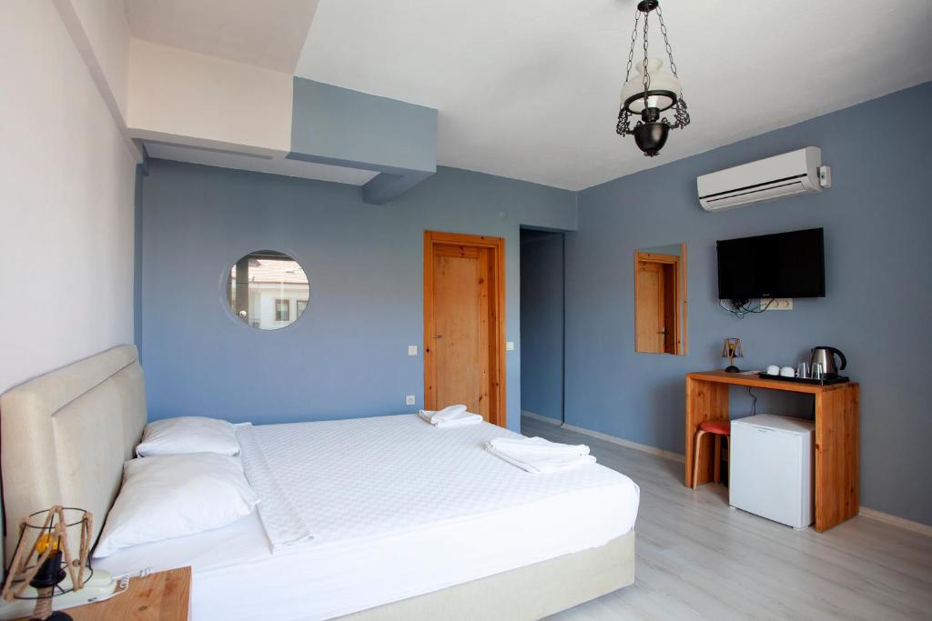 Postel nebo postele na pokoji v ubytování Zephyros City Otel