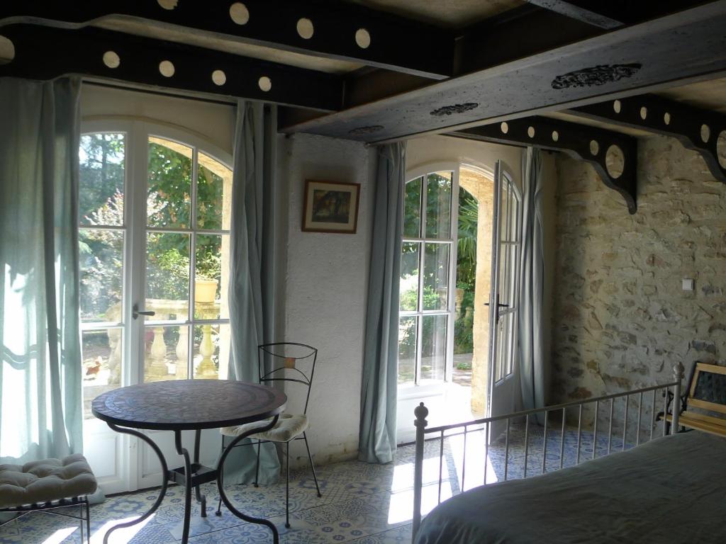 Postel nebo postele na pokoji v ubytování Le Manoir