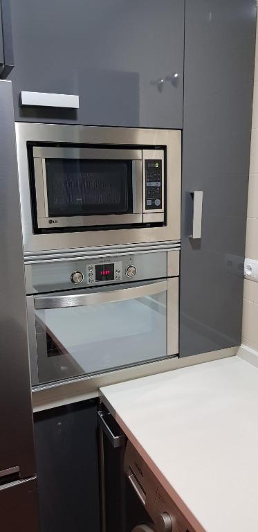 Kuchyň nebo kuchyňský kout v ubytování LA CASA DE HERACLES CADIZ