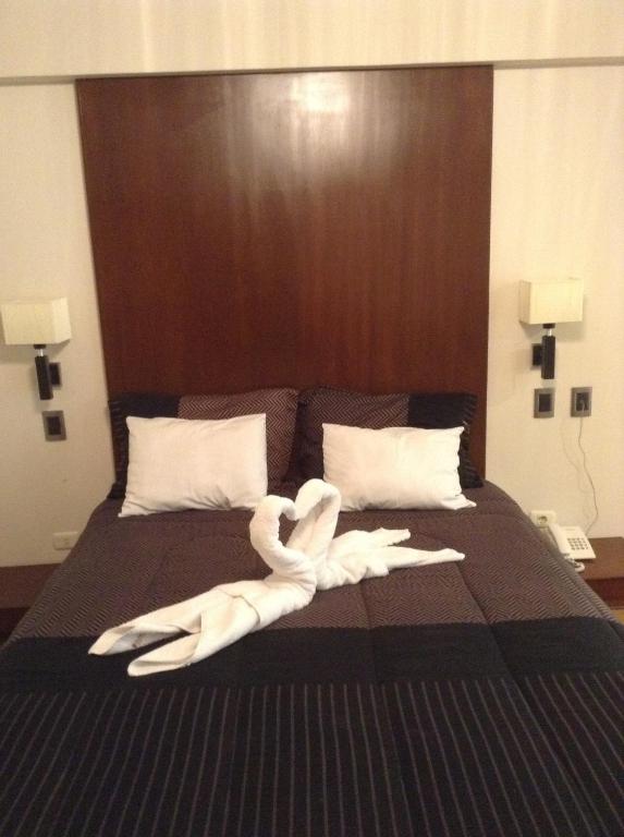 Postel nebo postele na pokoji v ubytování Miculla Hotel