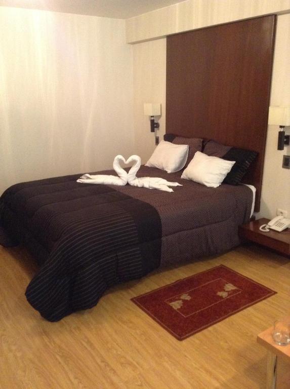 Postel nebo postele na pokoji v ubytování Miculla Hotel