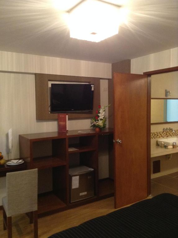 TV a/nebo společenská místnost v ubytování Miculla Hotel