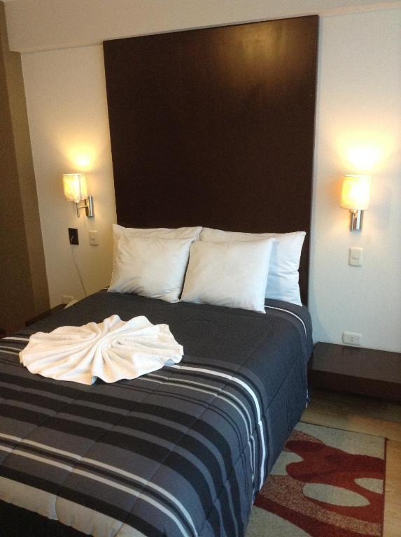 Postel nebo postele na pokoji v ubytování Miculla Hotel