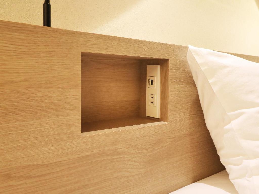 Postel nebo postele na pokoji v ubytování Odawara Terminal Hotel