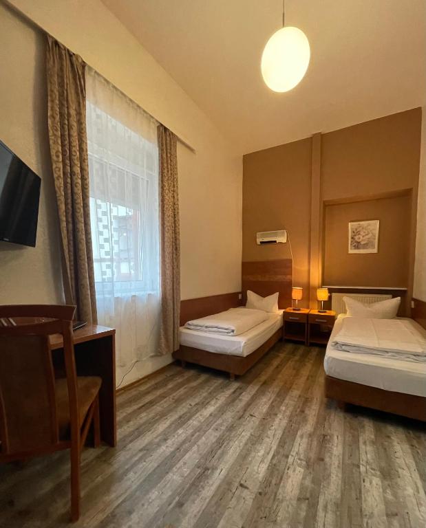 Postel nebo postele na pokoji v ubytování Hotel Monte Cristo