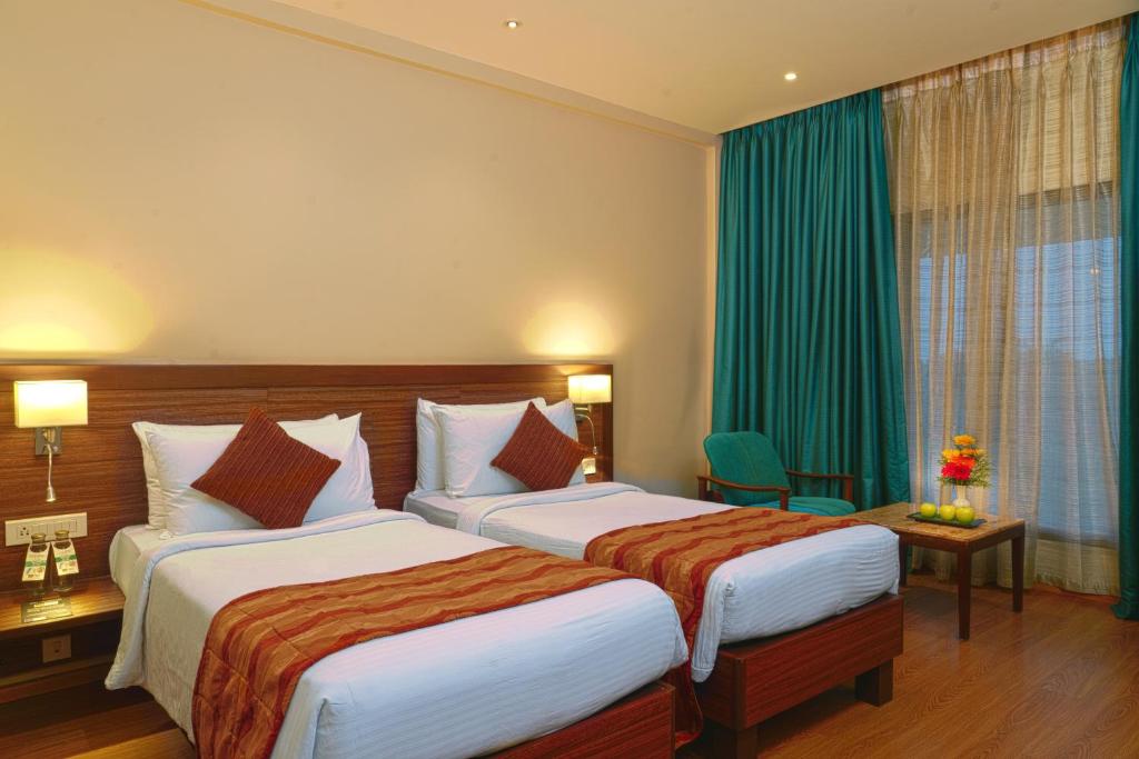 Postel nebo postele na pokoji v ubytování Fortune Pandiyan Hotel, Madurai - Member ITC Hotels' Group