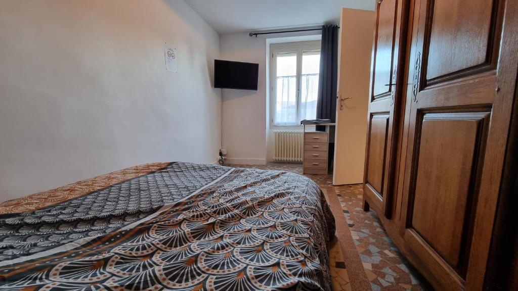 Postel nebo postele na pokoji v ubytování Le 3 Rue de Fontenay