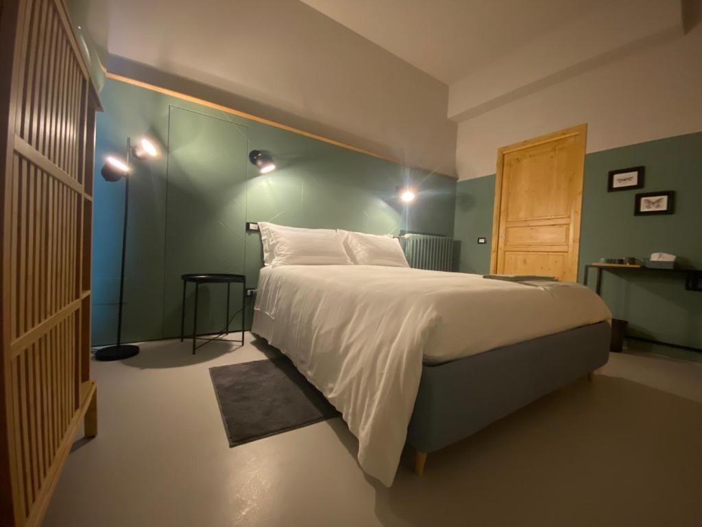Кровать или кровати в номере Casimiro Rooms